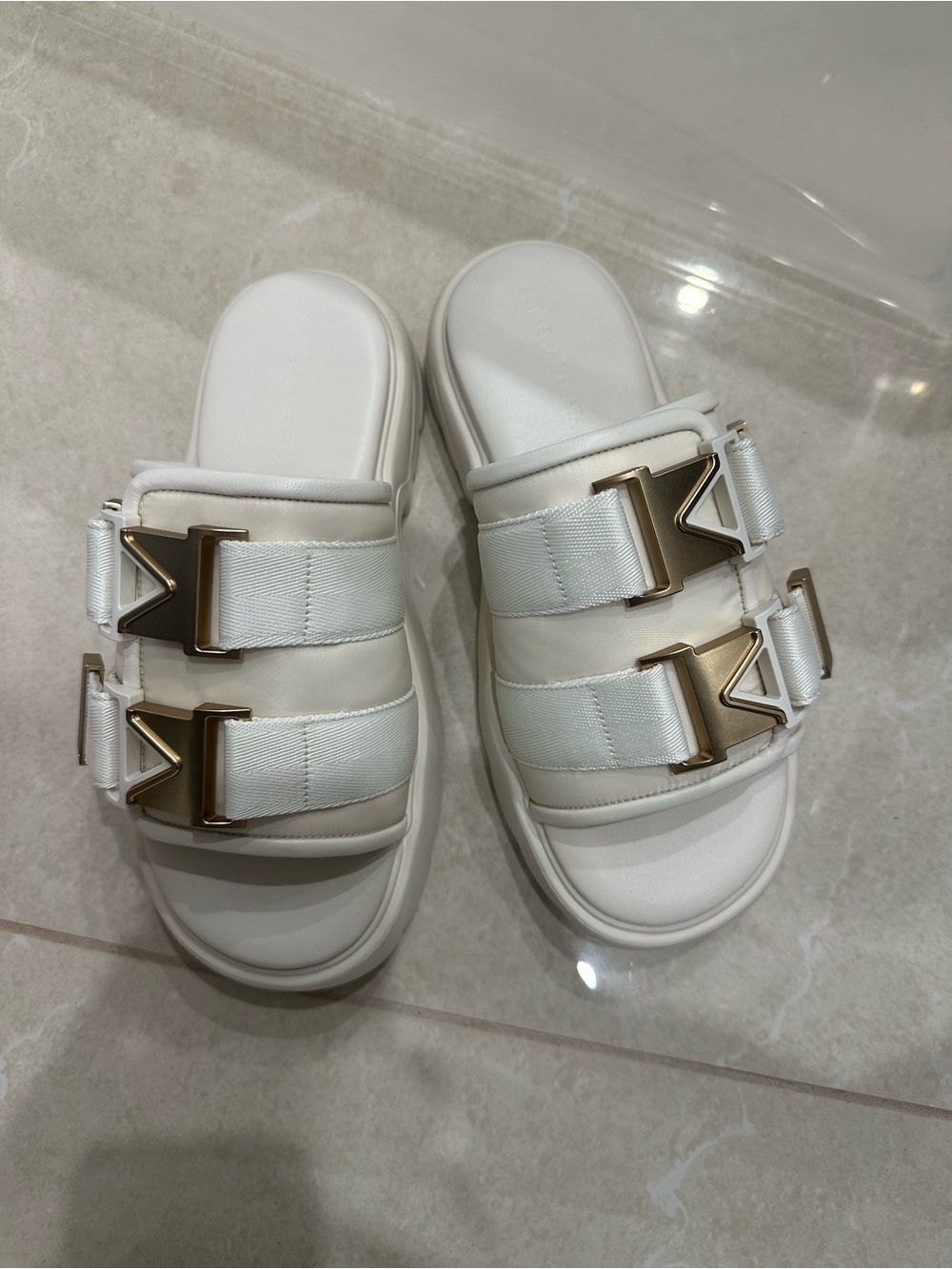 Bottega Veneta White Slide Sandals with Gold Buckle Accents